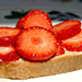 Sliced strawberries on pound cake