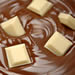 White chocolate chunks in melted milk chocolate