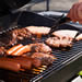 Hot dogs and patties on the grill.