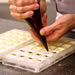 Filling chocolate molds
