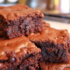 Brooke's Best Bombshell Brownies - Seduction straight from the oven! Rich, dark, and chocolatey, this brownie recipe uses cocoa powder, semi-sweet chocolate morsels, and butter, of course, to make an ultra intense chocolate treat.