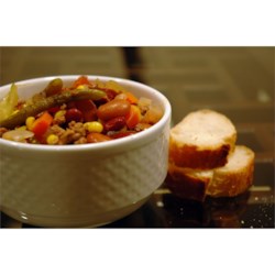 Italian Vegetable Soup Recipe and Video - Carrots, celery, onions, cabbage, corn, and green beans -- this soup is full of vegetables!  With ground beef, beans, and macaroni, a loaf of warm, crusty bread is all you need for a well-rounded dinner.