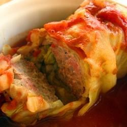 Cabbage Rolls II Recipe and Video - Cabbage leaves stuffed with ground beef, onion and rice, covered in a sweet and tangy tomato sauce and cooked in a slow cooker.
