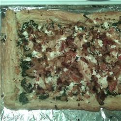 Puff pastry pizza with spinach, feta, and caramelized onion