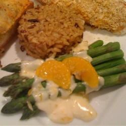 Photo about Asparagus with Orange-Cream Sauce and Cashews via allison125