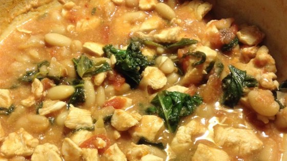 Chicken and tomato stew with arugula and cannellini