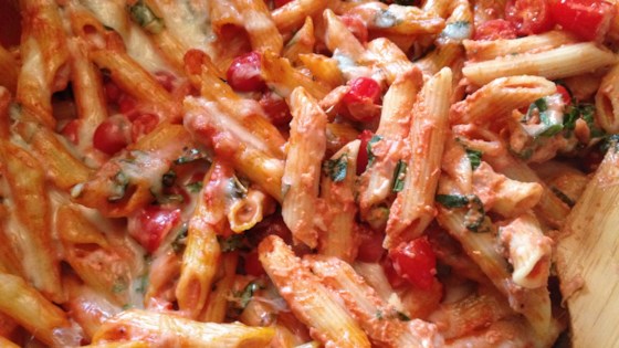 creamy pasta bake with cherry tomatoes and basil