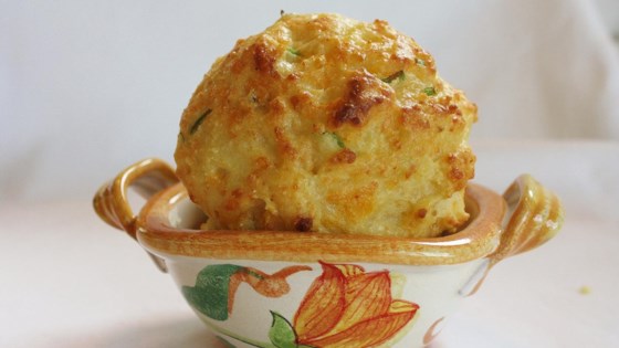 Photo about Cheddar Onion Drop Biscuits by trishthedish617