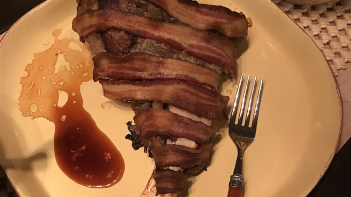 Bacon-Wrapped Leg of Lamb with Red Wine Reduction