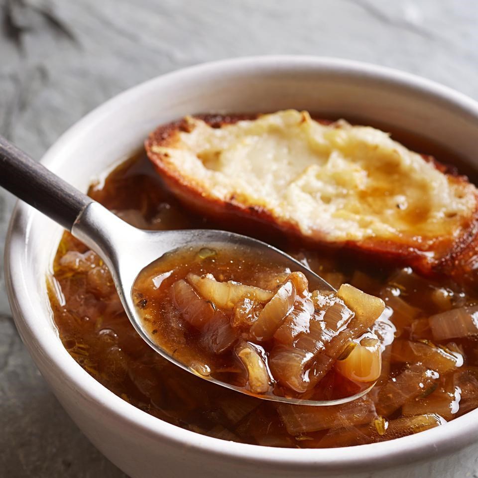 Bowl of classic French onion soup with caramelized onions and melted cheese